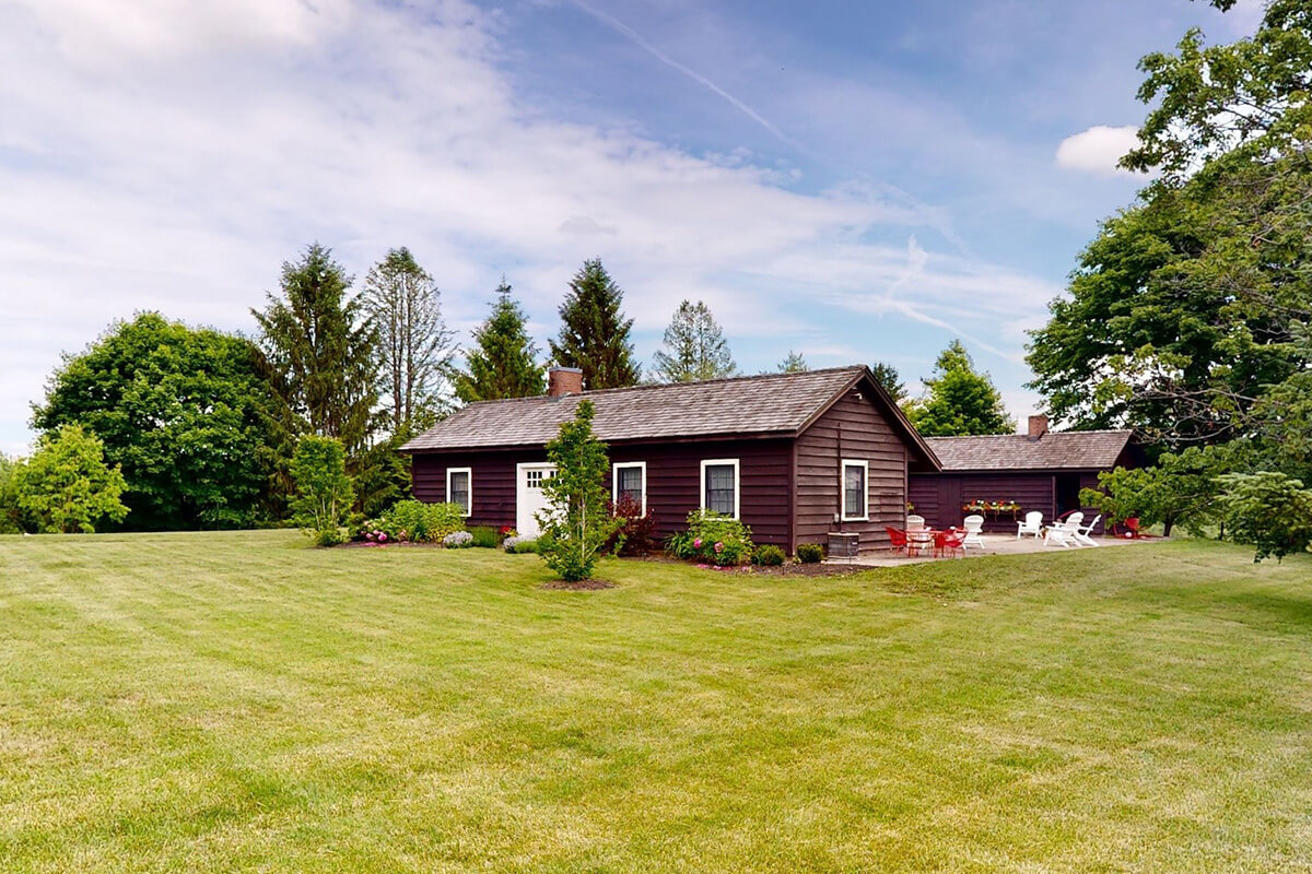 Bridal suite building with inground pool and scenic garden.